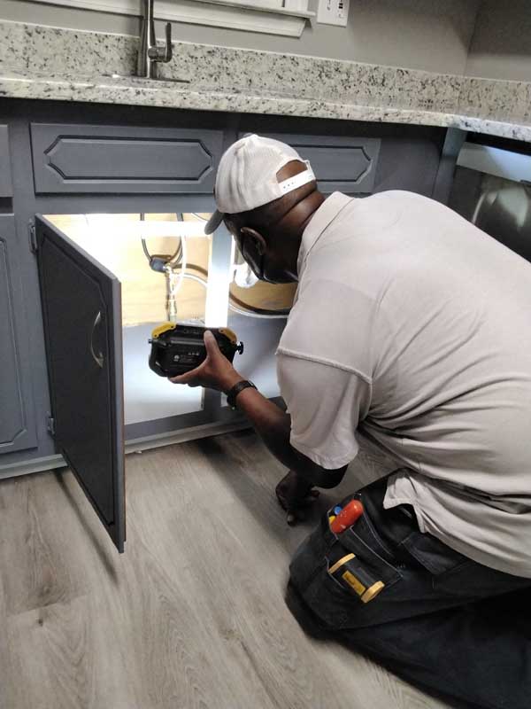 Absolute Home Inspection Service LLC inspector documenting an electrical panel for a written inspection report